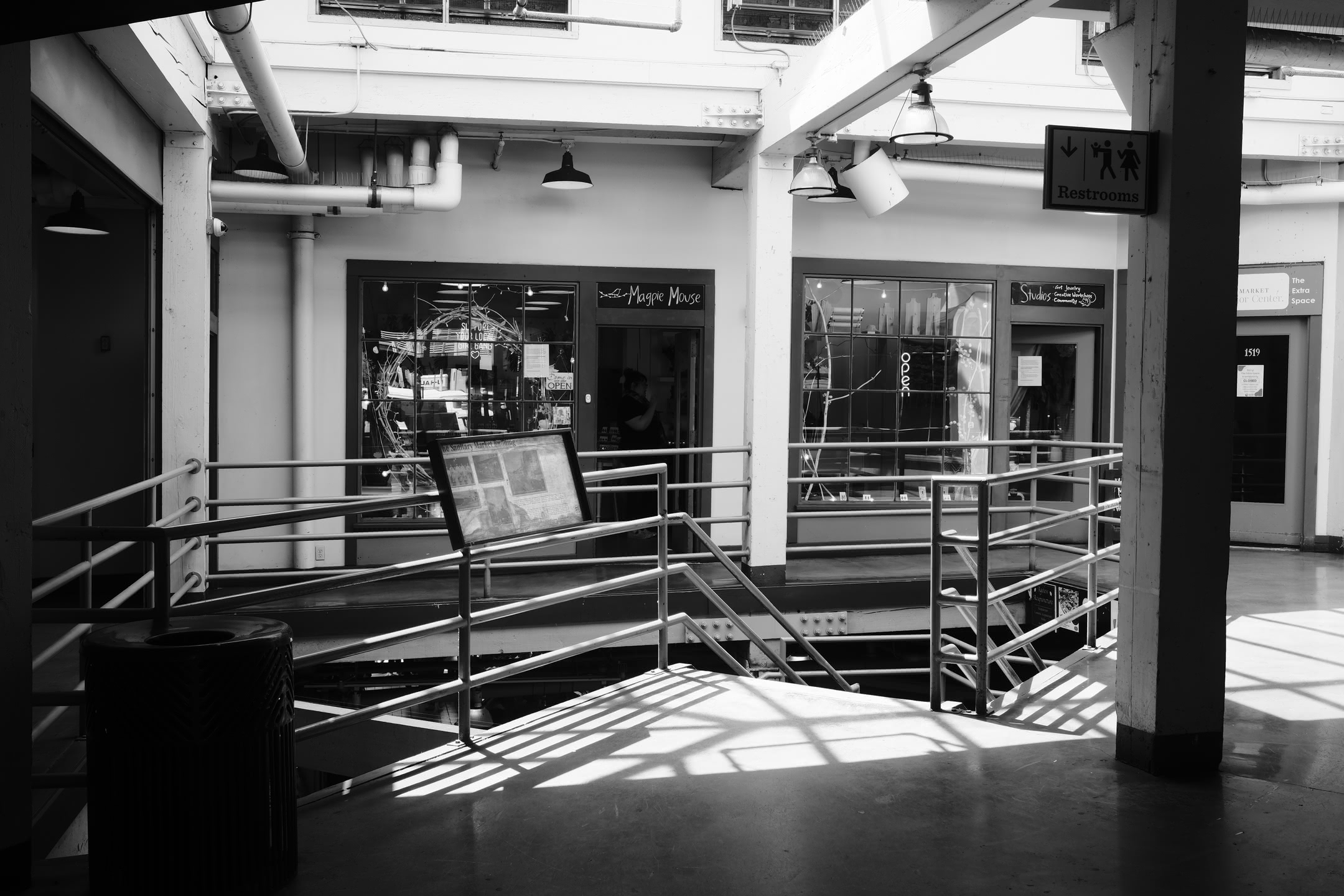 Shadows cast by skylight within a building at Pike Place Market.