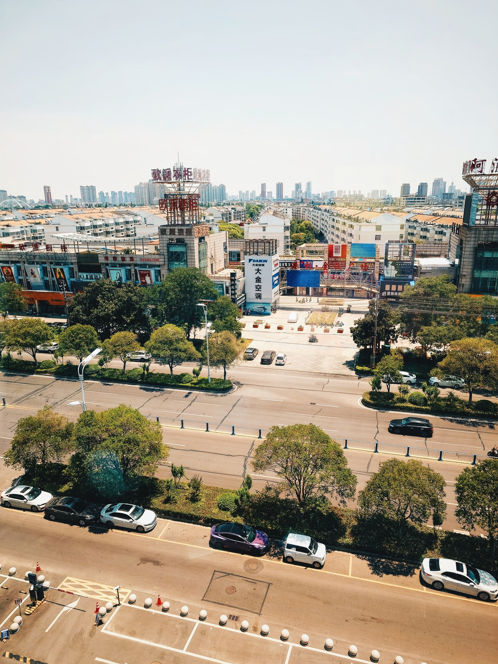 View of Fùyáng from hotel window, overlooking a street.