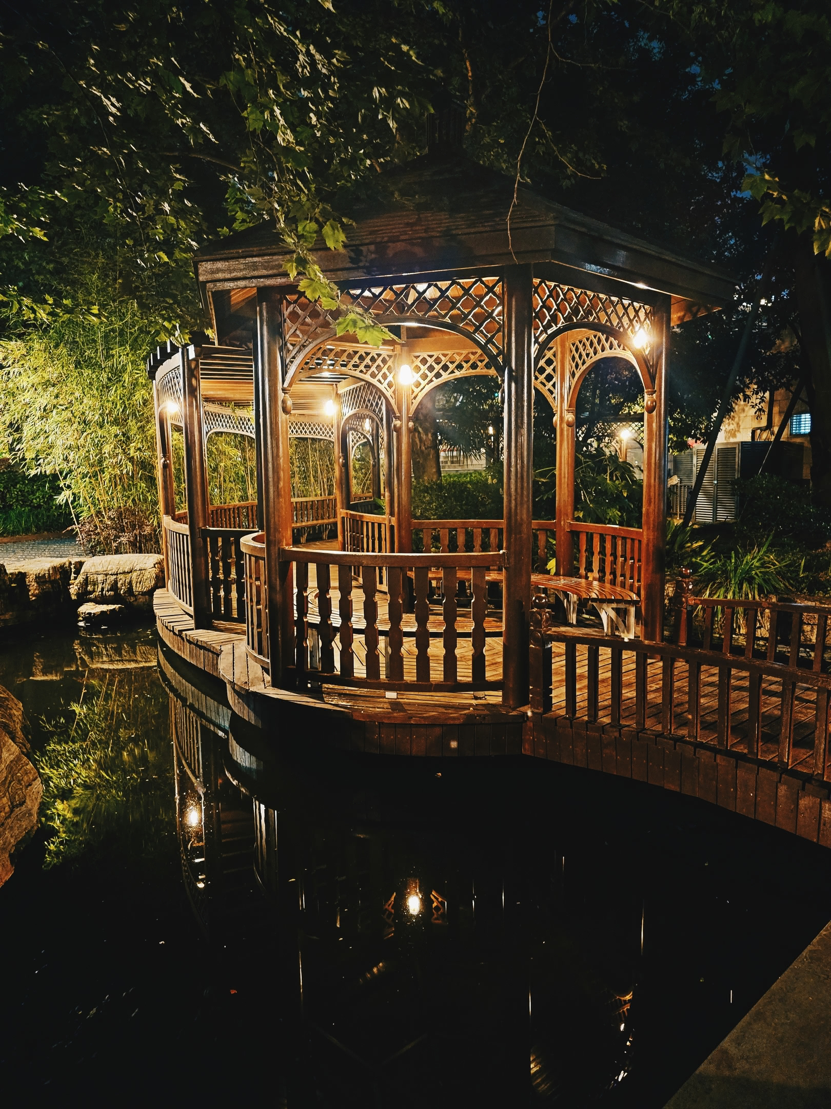 Gazebo over koi pond at night. Near The Bund.