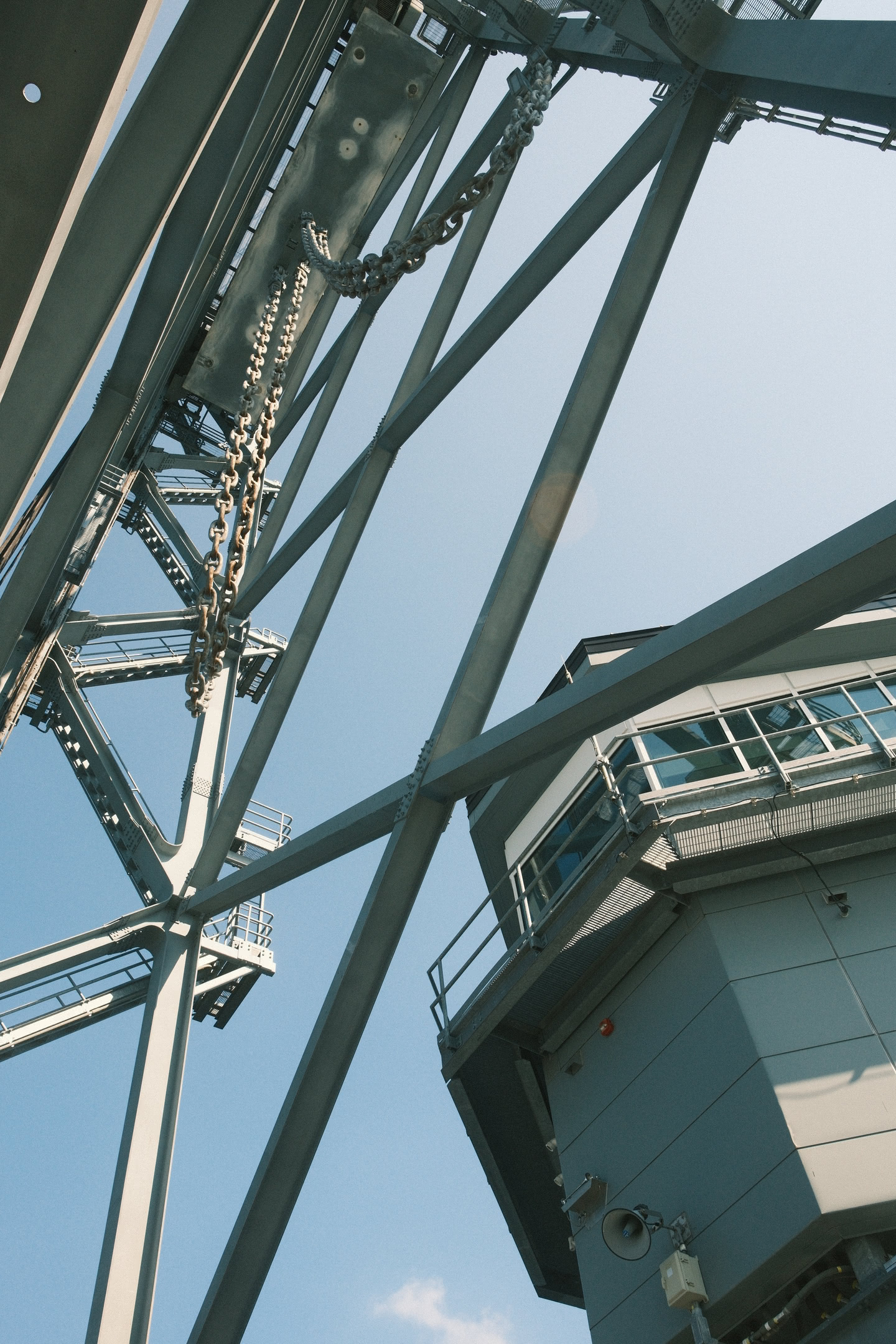 Looking up at the vertical lift span and control room for the bridge.